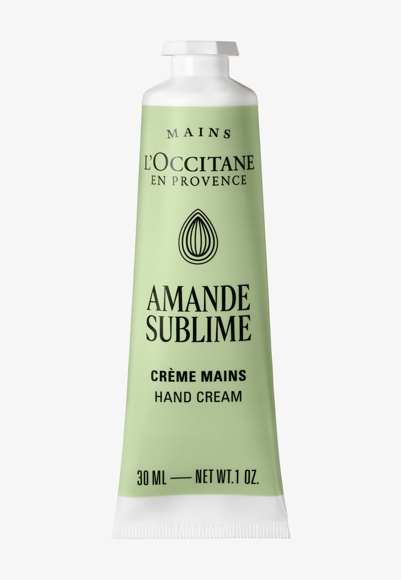 Tubetto di crema per le mani L'Occitane Amande Sublime, 30 ml, verde chiaro con testo nero e tappo bianco, icona della mandorla sotto il nome del marchio.