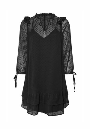 Abito lungo nero trasparente con pattern a pois, spalle arricciate, collo a fiocco e orlo a strati con rouches.