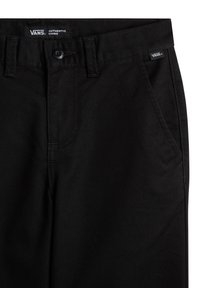 Schwarze Chino-Hosen mit einer glatten Stoffbeschaffenheit, klassischer Passform, Fronttaschen und Vans-Logotag am Bund.