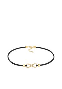 Sort ruskind choker med et guld uendelighedssymbol, der har en lille klar sten. Justerbar kædeklips bagpå.