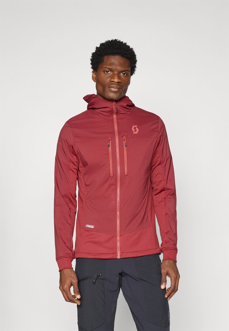 Rode lichtgewicht jas met een getailleerd design, voorzien van een capuchon, ritszakken en een logo op de borst. Glad textuur en ademend materiaal.