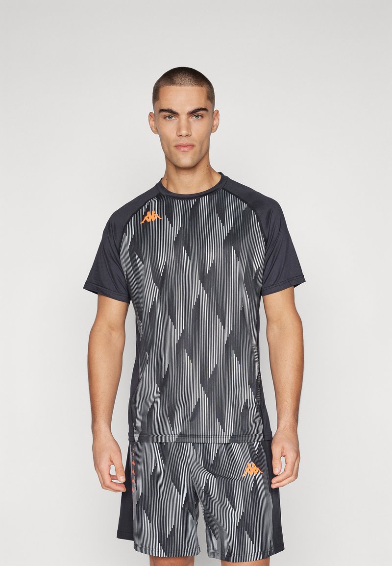 Sporty black and gray short-sleeve shirt and shorts set with vertical striped pattern; features orange logo and accents on shorts.
