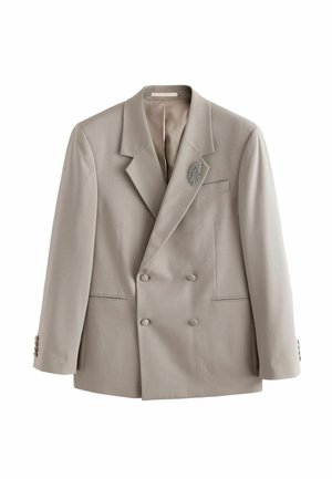 Light grey double-breasted blazer with textured fabric, notch lapels, two front pockets, buttoned cuffs, and silver leaf-shaped brooch on left lapel.