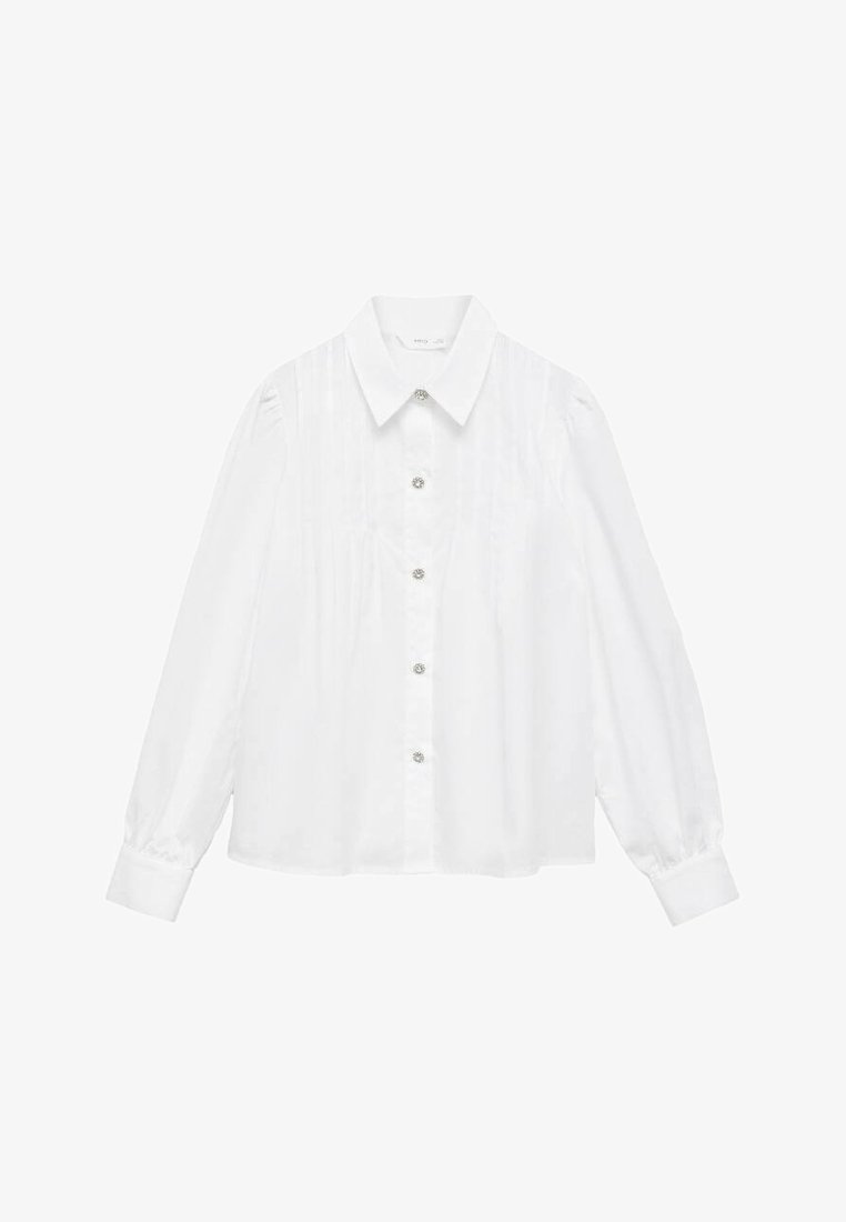 White long-sleeve blouse featuring a pointed collar, button front, and gathered detailing at shoulders. Made of smooth fabric with a clean finish.