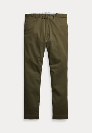 Pantalon vert olive en coton, présentant un devant plat, des passants de ceinture et une fermeture éclair. Le tissu a une texture lisse.
