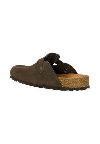 Chaussure marron en daim à enfiler ouverte à l’arrière, avec une bride ajustable et une semelle en liège, vue de profil sur fond blanc.