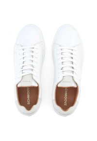 White sneakers with a smooth leather upper, six lace holes, padded ankle, and brown insoles featuring "SCHMOOV" embossed. Rubber sole.