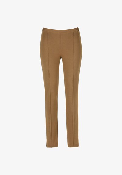 Brūni šauri diegi bikses ar priekša šuvju detaļām un maziem iegriezumiem pie potītēm, ar elastīgu vidukļa joslu.