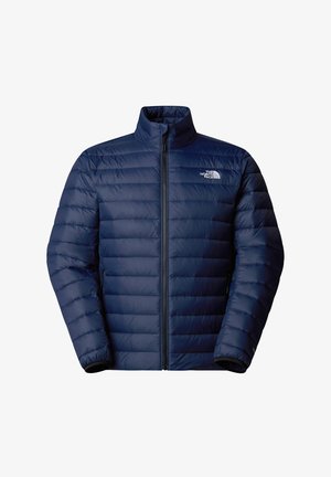 Chaqueta de puff en color navy con cuello alto, diseño acolchado, cremallera frontal completa y detalle del logo en el pecho. Cuenta con puños elásticos y bolsillos laterales.