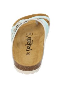 Light blue slide sandal with a cork footbed, white straps, and silver hardware accents. Inside features a textured brown surface.