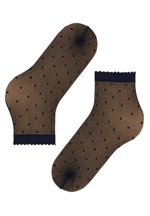 Paar durchsichtige schwarze Knöchelsocken mit kleinen schwarzen Polka-Dots und gewellten Rändern auf weißem Hintergrund.