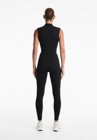 OYSHO EVERMOVE CREASE - Top - black