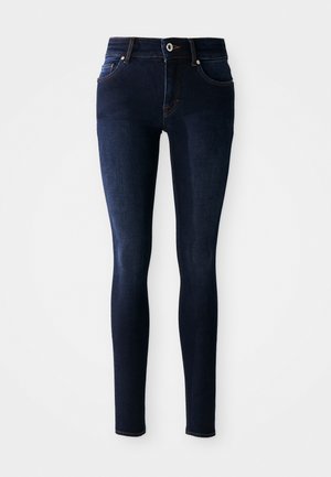 Donkerblauwe skinny jeans van denim, met een hoge taille, vijf-pocketdesign en stiksels op de zakken en tailleband.