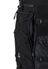 Black backpack with multiple zippered compartments, textured fabric, and elastic cord accents. Features adjustable straps and branded logo detail.