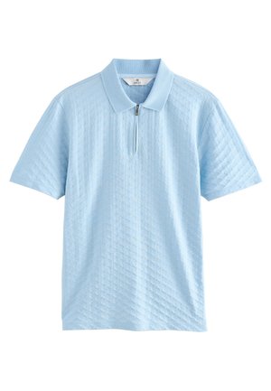 Light blue polo shirt with short sleeves, zipper neck, textured diamond pattern, and a soft knit fabric. Brand label visible inside collar.