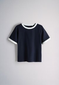 Short-sleeve navy blue T-shirt with white trim on collar and sleeve edges, displayed against a plain light gray background.