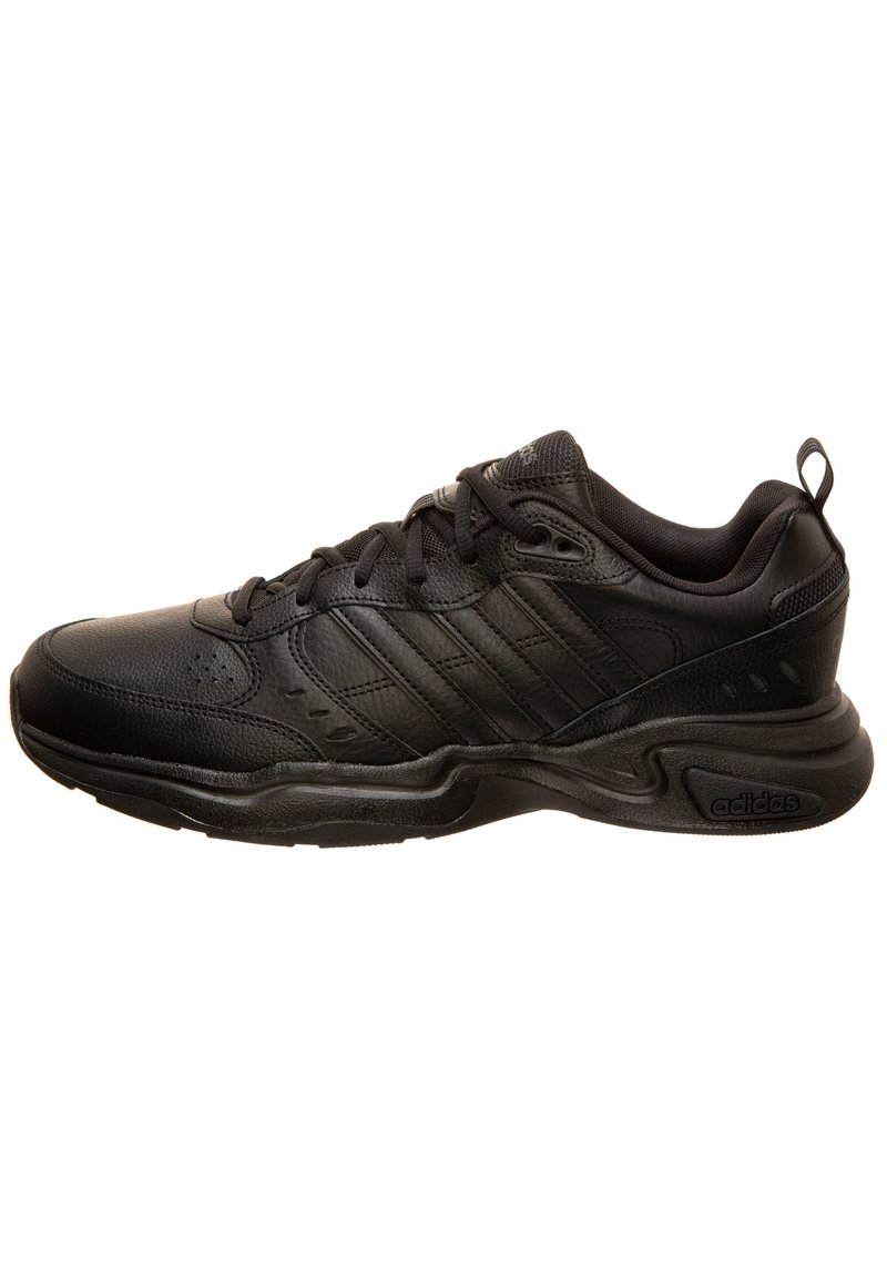 Black athletic shoe featuring a textured leather upper, reinforced toe, padded collar, and a cushioned sole for comfort.