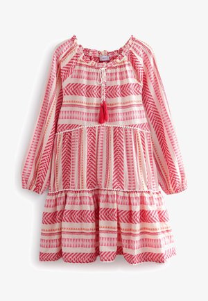 Robe à motifs roses et blancs avec des manches longues, design à volants en plusieurs niveaux, encolure élastique et détail en pompons rouges. Matériau en coton.