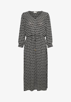 Robe midi à manches longues avec motif géométrique en noir et blanc, manches élastiquées, encolure ronde et taille à cordon avec détails de couleur dorée.
