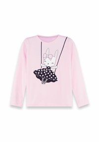 Maglietta a maniche lunghe di un rosa chiaro con un'illustrazione in bianco e nero di un coniglio che indossa un vestito a pois, appeso a dei fili neri.