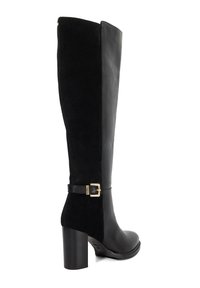 Knee-high black boots featuring a combination of leather and suede, with a gold buckle accent on a leather strap and a chunky heel.