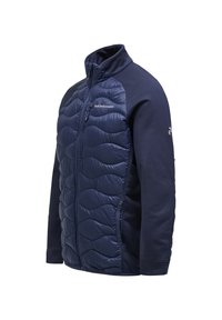 Navy jacket featuring a quilted front with wave patterns, soft fabric sleeves, high collar, and front zipper closure.