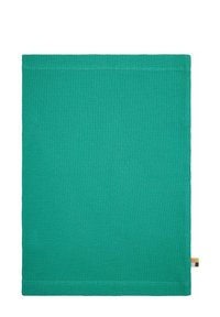 Tovaglia in cotone verde testurizzato con un motivo a coste e bordi rifiniti. Presenta un piccolo etichetta multicolore su un lato.