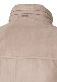Beige suede jacket with a button-down collar. Features a small bugatti tag and subtle texture. Clean stitching along the seams.