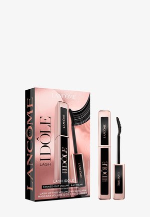 Máscara de pestañas Lancôme Lash Idôle con cepillo curvado y embalaje en tono rosa dorado, presentada junto a su caja que destaca su volumen abanico y duración de 24 horas.