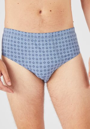 Boxer bleu fabriqué dans un tissu doux, avec un motif géométrique répété en bleu foncé. Ceinture élastique, texture lisse, design ajusté.