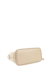 Sac à main beige de créateur montré par le dessous, avec une base en cuir lisse et des côtés en tissu à motifs avec détail de fermeture éclair.