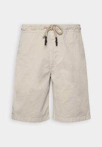 Beige cotton shorts with elastic waistband and beige drawstring with dark brown tips, front seam detail, and above-knee length.
