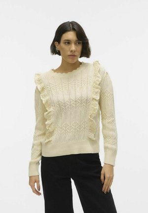 Maglione lavorato a maglia color crema con dettagli arricciati e modelli a diamante testurizzati, caratterizzato da un collo rotondo e maniche lunghe.