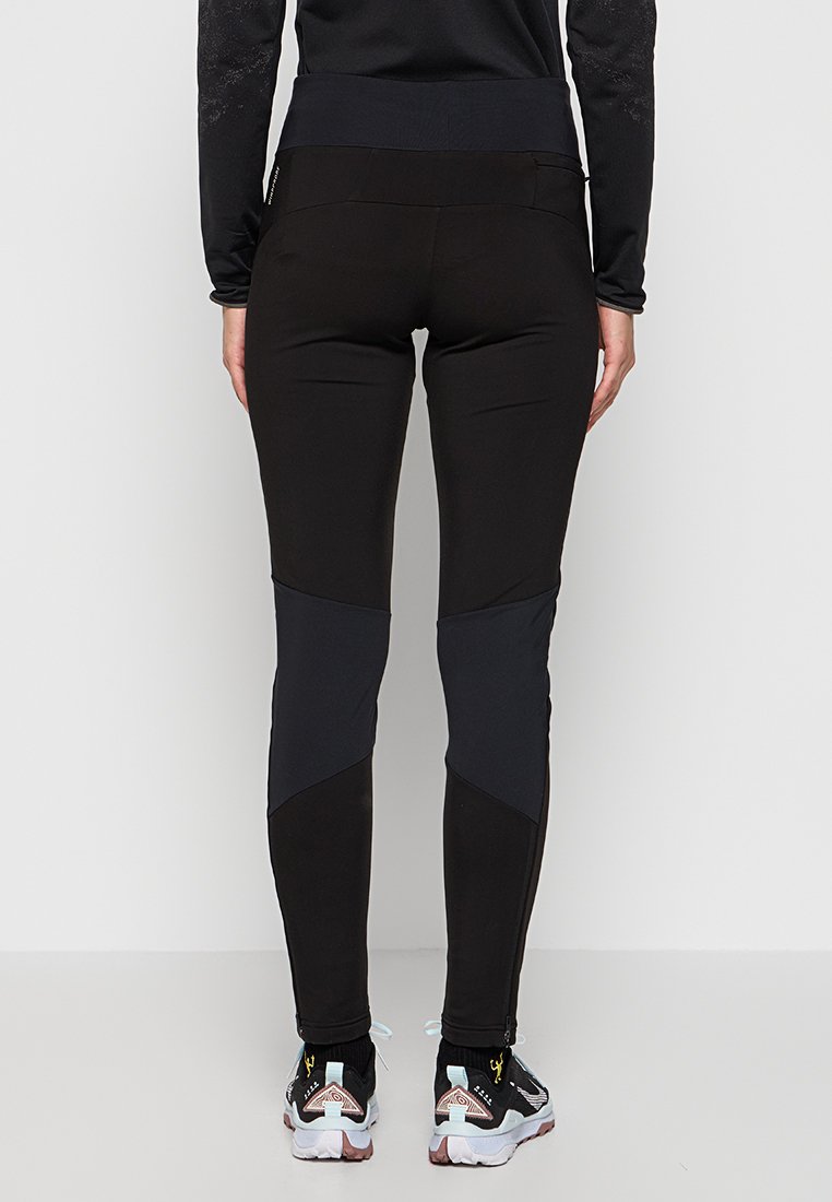 Schwarze sportliche Leggings mit einem hohen Bund, die ein elegantes Design und kontrastierende dunkelgraue Einsätze an den Außenseiten aufweisen.
