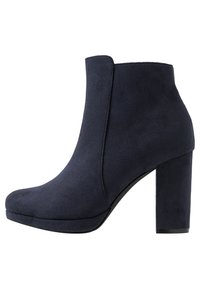 Navy blue suede ankle boot with a rounded toe and chunky high heel, side seam detailing, and smooth sole.