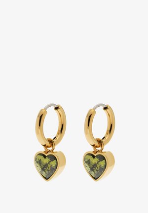Gold hoop earrings with dangling heart-shaped green gemstones, polished and reflective, displayed against a white background.