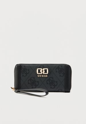 Melna maks ar teksturētu sintētisko materiālu, reljefā iespiestu logotipu rakstu, zelta tonī metāla detaļām un noņemamu rokas siksniņu.