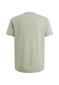 Svetlozelené bavlnené tričko s okrúhlym výstrihom, krátkymi rukávmi a rovnou spodnou časťou. Má malý uško na zadnej strane na zavesenie.