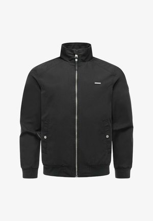 Black zip-up jacket with high collar, two snap-button pockets, ribbed cuffs and hem, and a small rectangular logo on the chest.