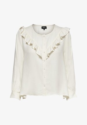 Witte blouse met lange mouwen, knopen aan de voorkant en ruches die een V-vorm vormen over de borst en schouders.
