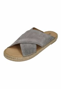 Gray suede slide sandal with a crossover strap design, jute braided sole, and flat footbed.