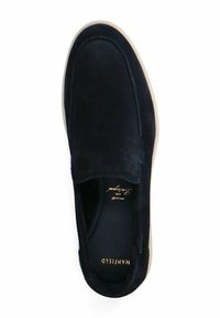 Black suede slip-on shoe with rounded toe, minimal stitching, tan rubber sole, and gold embossed logo inside. Smooth texture throughout.