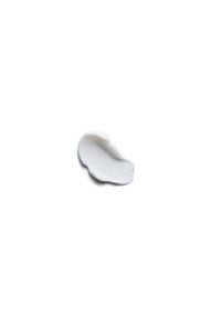 Crème blanche avec une texture lisse et brillante, en forme de bulle, et un bord arrondi sur un fond blanc. Aucun marquage ni motif visible.