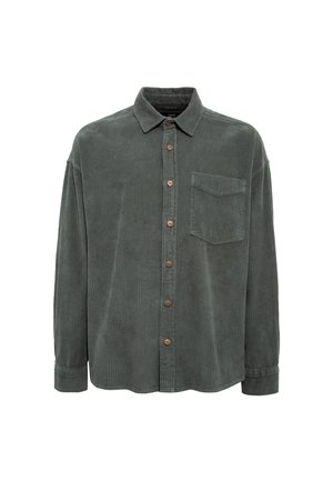 Corduroy shirt in dark green with a button-up front, pointed collar, single chest pocket, and wooden buttons. Soft texture with ribbed pattern.