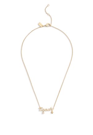 Collier ton or avec le mot "coach" en cursive, accompagné d'un petit cœur pendu et d'un accent en pierre précieuse. Chaîne fine avec fermoir.