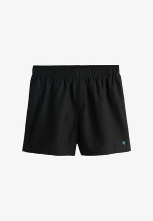 Sorte badeshorts lavet af letvægtsstof med elastisk taljebånd og et lille blåt palmetrælogo på nederste højre side.