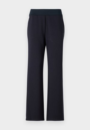 Schwarze, lässig geschnittene Hosen mit breitem Bund. Hergestellt aus weichem Stoff, mit zwei Seitentaschen und einer glatten Textur. Keine sichtbaren Muster.