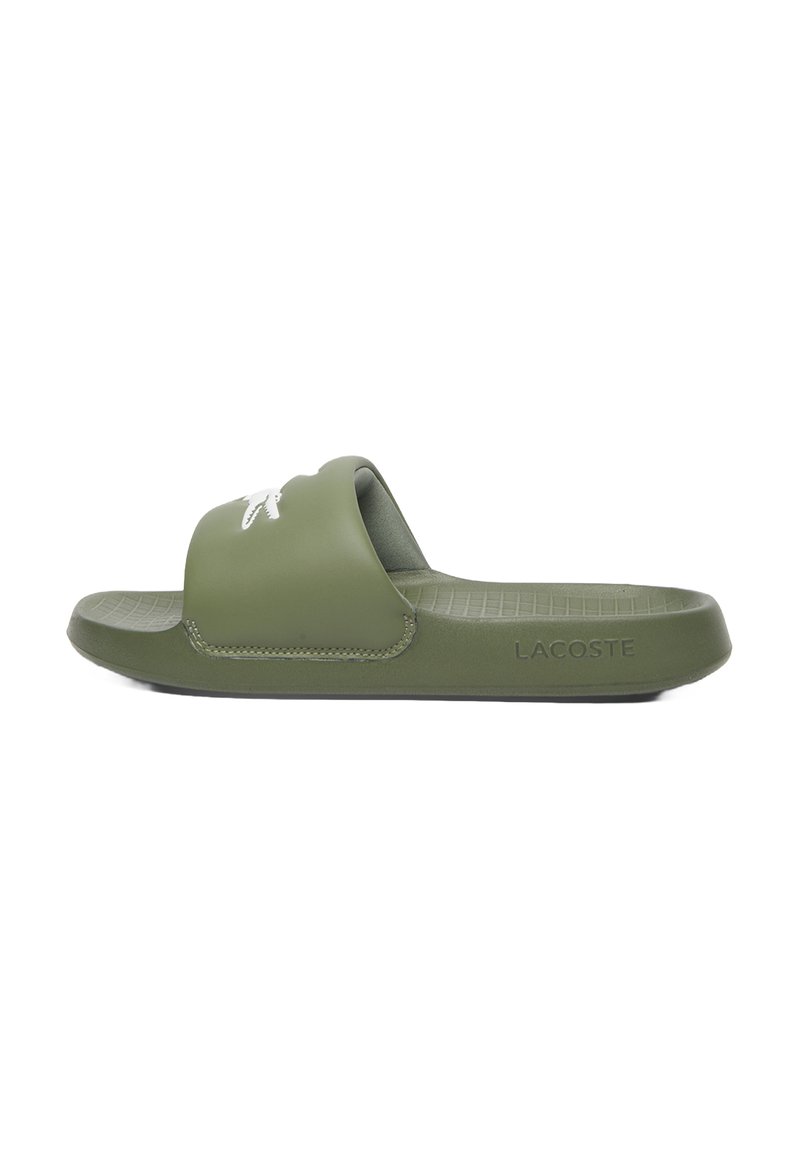 Green rubber slide sandal with a wide strap, featuring a small white logo on the front and textured sole for grip.