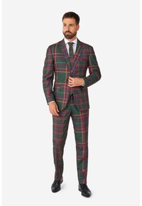 Zelený kostkovaný oblek s kostkovaným vzorem s červenými a žlutými akcenty, jednoradový blejzr a odpovídající kalhoty.
