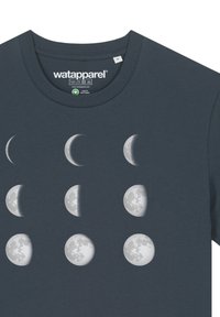 Dark blue cotton t-shirt featuring a graphic of moon phases in white and gray, placed in three rows of three on the front.